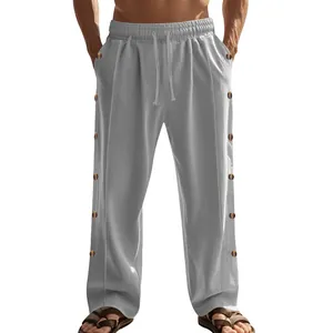 Pantalon décontracté en lin pour homme avec cordon et boutons latéraux décoratifs gris.