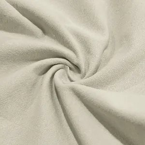 Macro detail of breathable cream linen fabric texture for bohemian style men's casual trousers