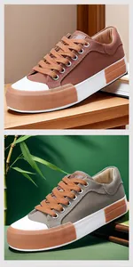 Close-up detail of stylish men's low-top canvas sneakers in brown and grey with white rubber sole