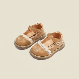 Brown toddler princess shoes with delicate white lace trim and flower embroidery