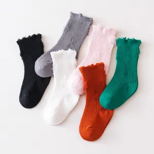 Pack of colorful distressed children's ribbed mid-calf socks in six trendy assorted colors