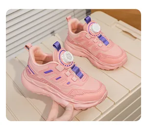 Close-up of pink girls' breathable mesh sneakers with a convenient rotary buckle system