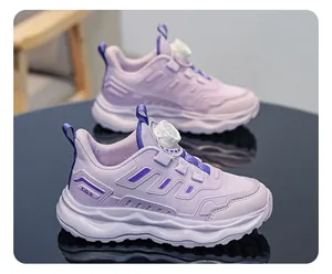 Detailed view of purple mesh kids running shoes with convenient rotary buckle closure.