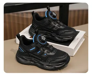 Close-up of black children's breathable mesh sneakers with blue accents and rotary buckle