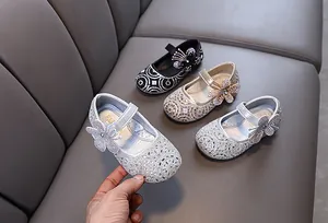 Close-up of sparkling girls rhinestone princess Mary Jane shoes for performance