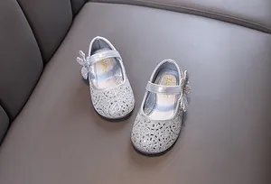 Shiny silver princess shoes for girls with sparkling rhinestone butterfly bow detail