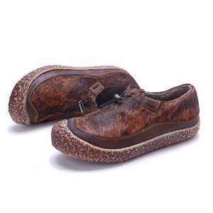 Detailed view of handmade retro loafers featuring horsehair texture and colorful stitching
