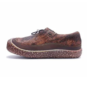 Side view detail of a retro handcrafted leather and horsehair patchwork women's casual shoe.