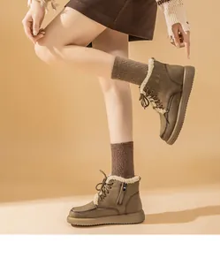 Detailed side view of brown lamb wool snow boots with lace-up and side zipper design