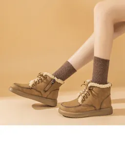 Brown suede lamb wool snow boots with lace-up detail and side zipper for winter warmth