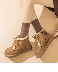 Women's warm brown suede snow boots featuring cozy lambswool lining and side zipper detail