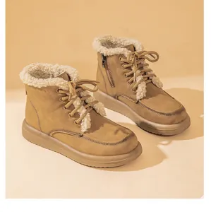 Warm beige sheepskin fur-trimmed winter snow boots featuring lace-up design and flat soles