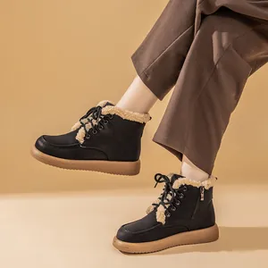 Winter black lamb wool lined flat snow boots with lace-up design and warm fur trim