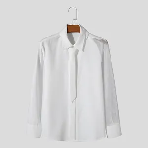 Detail shot of a white men's long-sleeve shirt featuring a unique mesh sleeve panel.