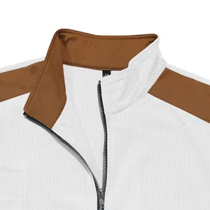 Close-up detail of men's casual jacket featuring brown color block and metal zipper