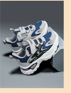 Detailed macro view of children's non-slip sneakers with chunky sole in blue and grey