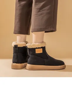 Side view of black snow boots with warm faux shearling lining and brown soft soles