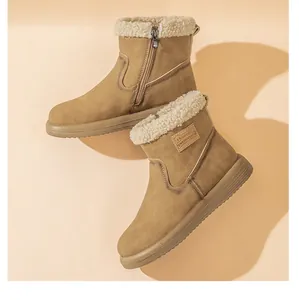 Detail view of khaki winter snow boots with warm lamb wool lining and side zipper.