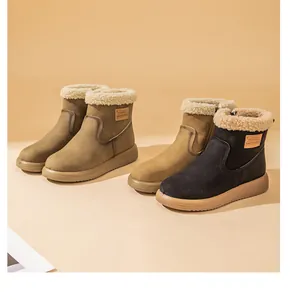 Detailed shot of stylish winter snow boots featuring warm sherpa cuffs and retro side patches