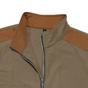 Detail view of men's casual corduroy jacket featuring contrast suede patchwork and zipper