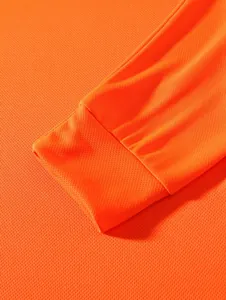 Detail of orange men's long-sleeve shirt with breathable mesh fabric and ribbed cuff.