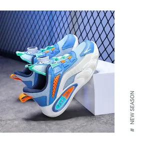 Detailed close-up of blue breathable mesh boys sneakers with rotary dial lacing system