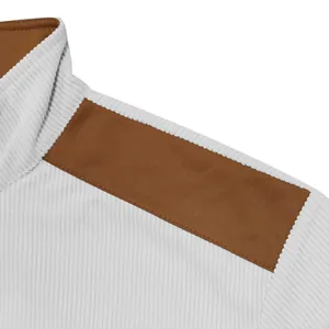 Close-up of ribbed cotton velvet jacket with brown suede shoulder patchwork