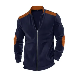 Close-up of ribbed texture and elbow patch detail on men's navy blue zipper jacket