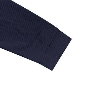 Detailed view of the ribbed sleeve cuff on a navy blue heavy cotton velvet zip cardigan