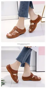 Detailed side view of brown platform wedge sandals with laser-cut stitch pattern details
