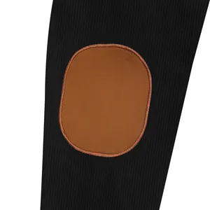 Close-up detail of the brown faux suede elbow patch on a black ribbed fabric sleeve
