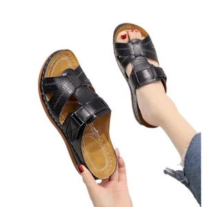 Women's black wedge sandals with hollow-out straps and thick cushioned soles