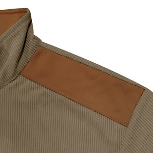 Macro detail of corduroy jacket with brown suede shoulder patch and stand collar