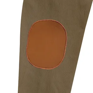 Detailed macro shot of the oval elbow patch and ribbed fabric on casual winter jacket