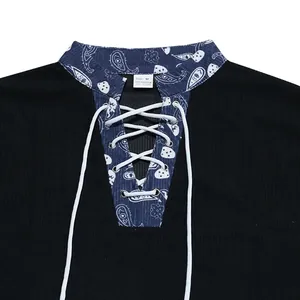 Close-up detail of men's heavy corduroy Henley shirt with blue paisley lace-up neck