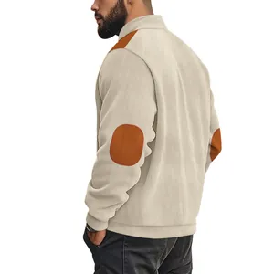 Back view of men's beige ribbed jacket with brown elbow and shoulder patches.