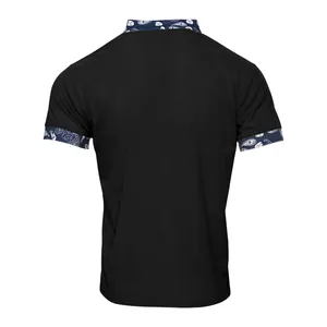 Back view of a black heavy corduroy men's shirt with blue paisley print trim on cuffs