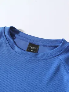 Close-up detail showing the collar and brand tag of a blue mesh long sleeve men's shirt