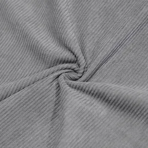 Macro detail of grey corduroy fabric showing heavy texture and soft vertical ribs