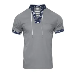 Detailed view of gray corduroy Henley shirt with navy paisley collar and lace-up front