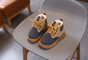 Warm fleece-lined kids Martin boots in tan and grey, perfect for winter comfort.