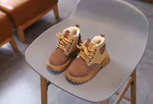 Detailed macro view of warm children's Martin boots featuring soft faux fur lining.