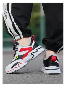 Close-up of boys' winter running shoe with warm fleece lining and red accents.