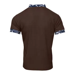 Rear detail of a men's brown corduroy Henley shirt featuring blue paisley collar trim.