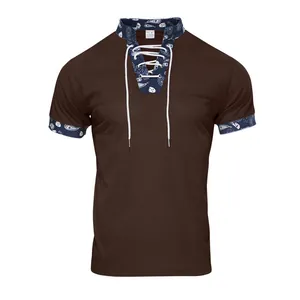 Detailed view of men's corduroy Henley shirt with paisley collar and lace-up front.