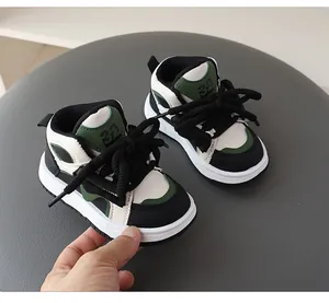 Detailed side view of stylish kids high-top sneakers in green and black dopamine colorway
