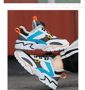 Close-up of boys warm winter sneakers with fleece lining and rotary dial lacing