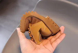 Soft and flexible child's Martin boot in brown leather with non-slip sole detail