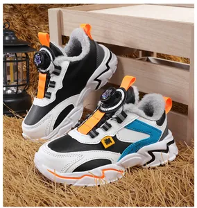 Close-up of children's winter running shoes with thick fleece lining and dial lacing.