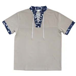 Men's heavy beige corduroy henley shirt featuring paisley pattern trim and a lace-up front